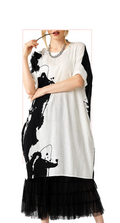 T2632  oversized tunic with a bold black and white abstract print.