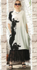 T2632  oversized tunic with a bold black and white abstract print.