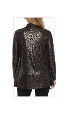 Woman wearing a TERRA leopard print long-sleeve top 