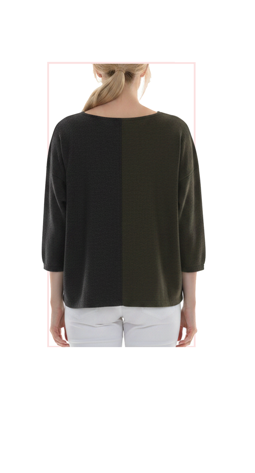 Woman wearing TERRA black and gray oversized color-block top, rear view