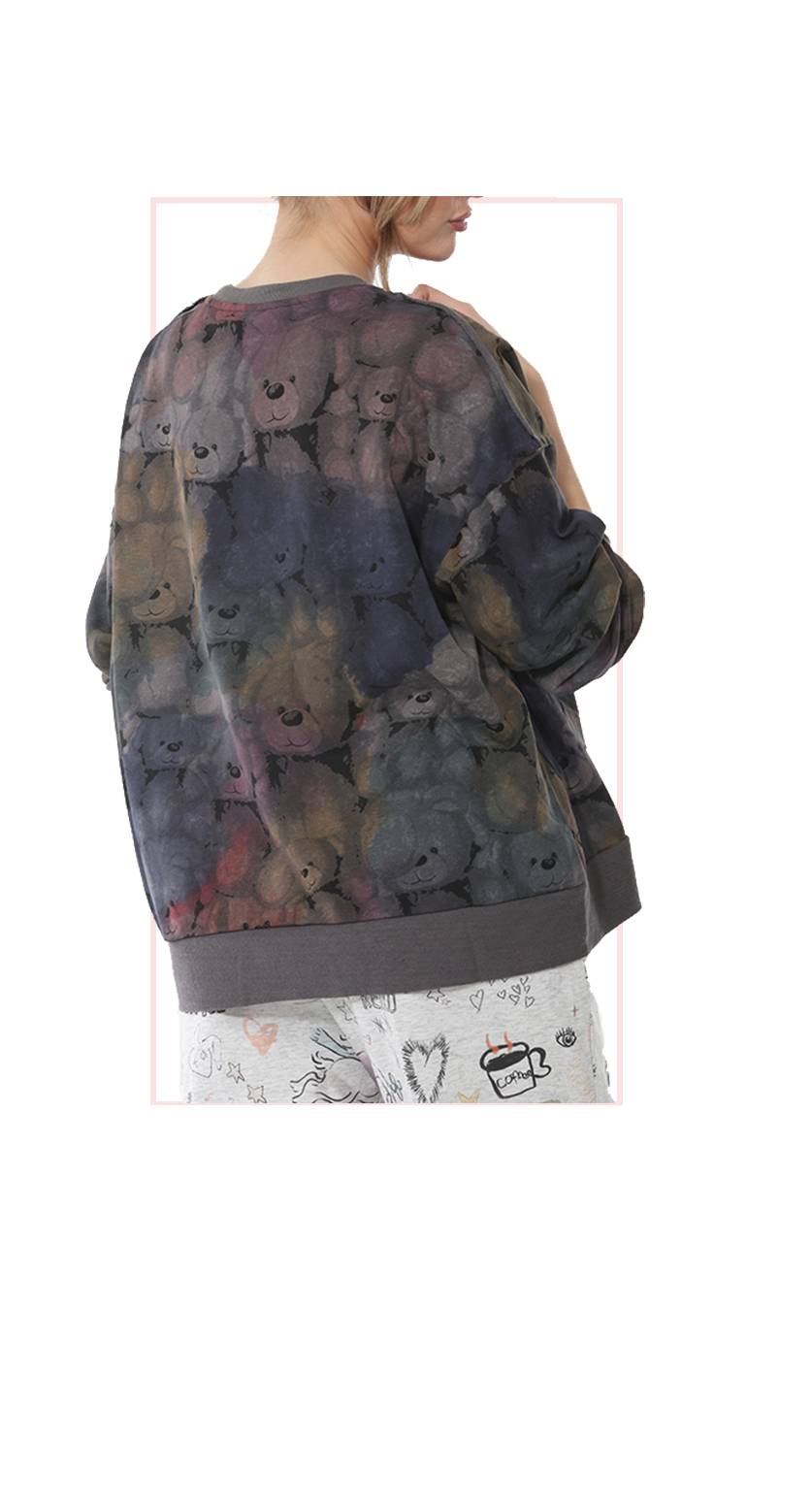 woman wearing a colorful Terra teddy bear graphic longsleeve sweater rear view