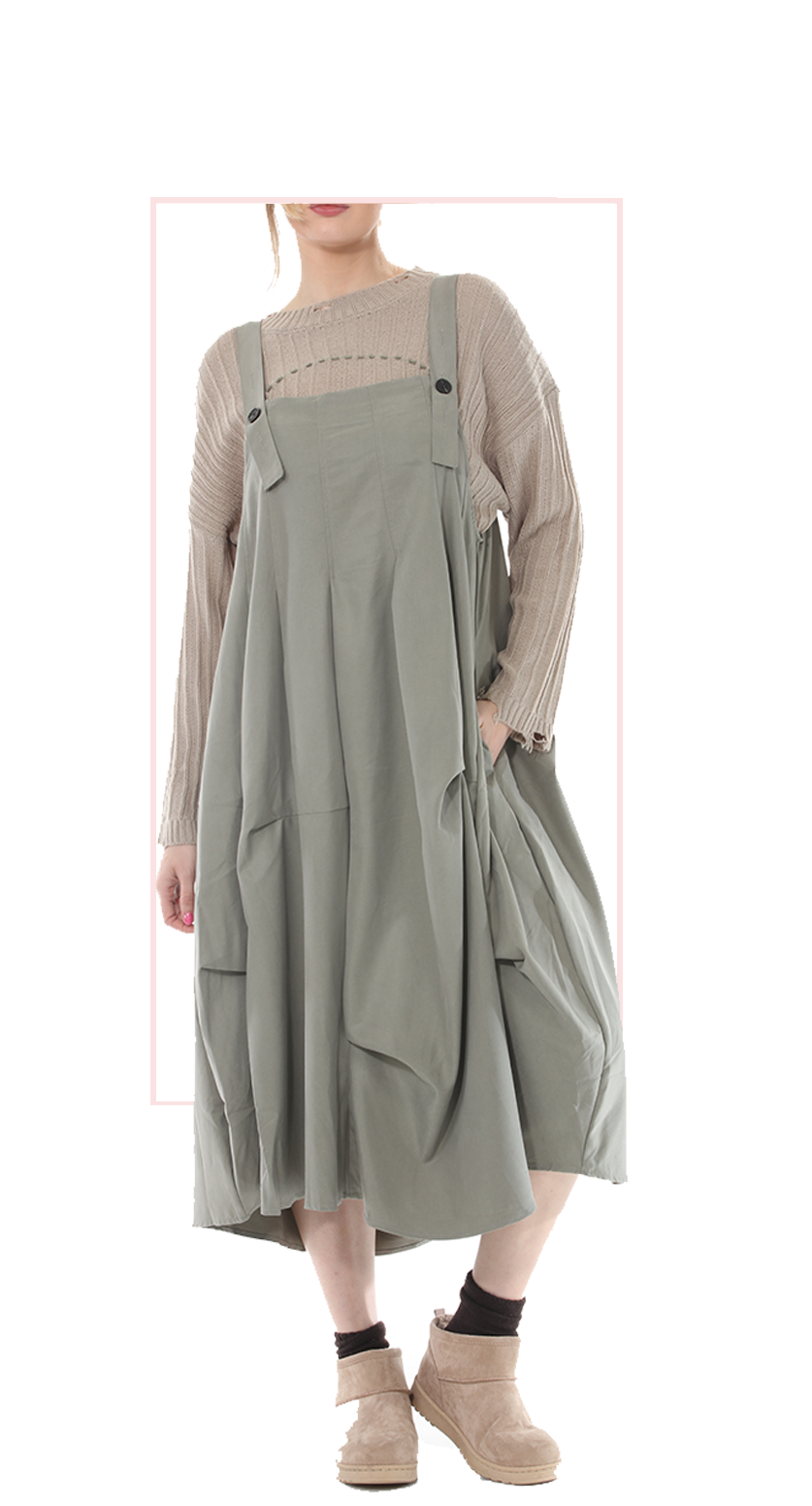Woman wearing TERRA beige pinafore jumper dress, front view