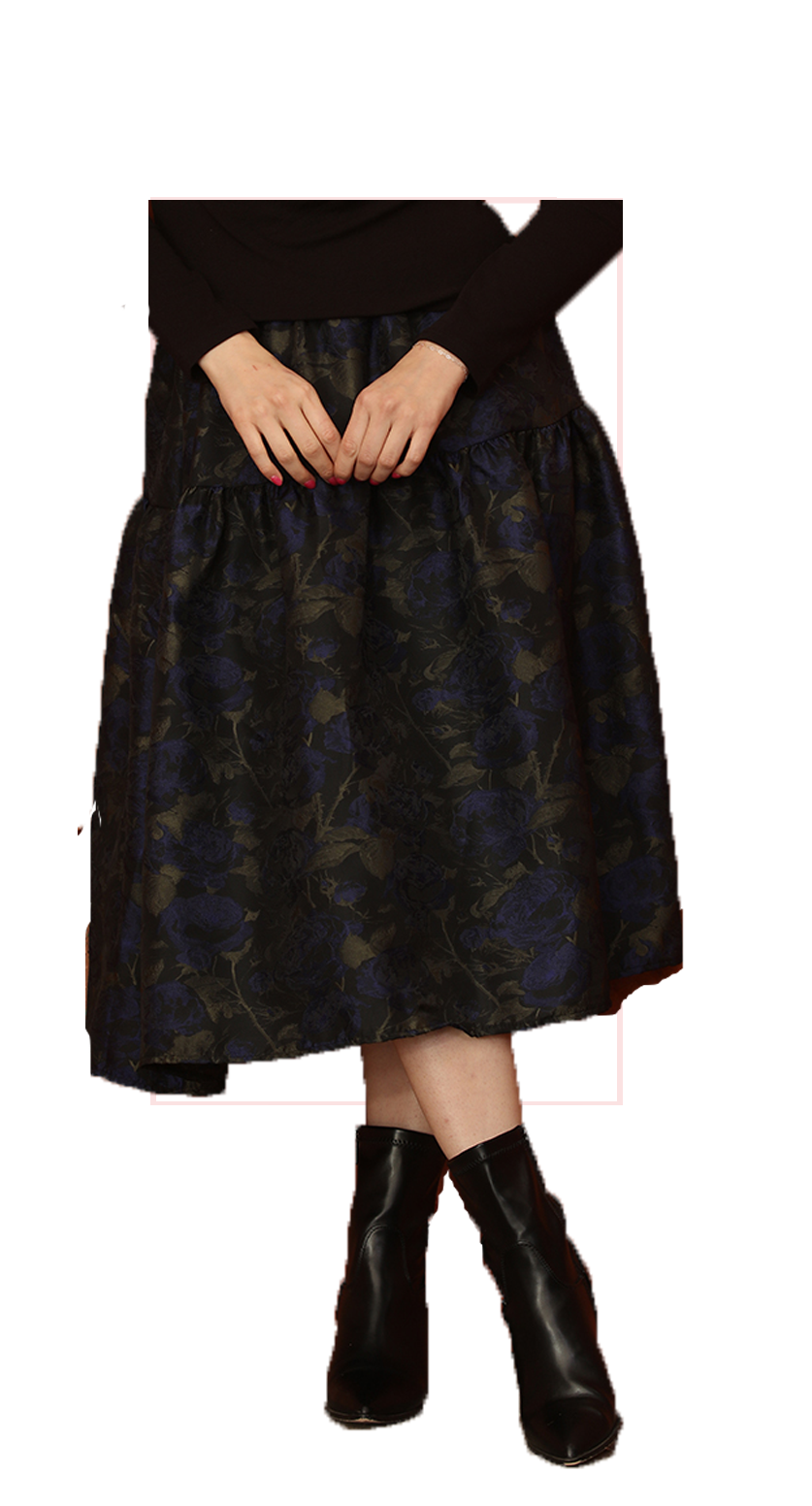 Woman wearing TERRA black and blue floral patterned midi skirt