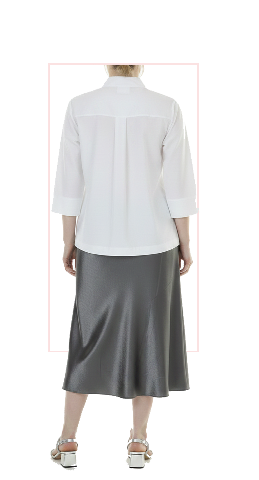 Woman wearing TERRA silver satin A-line maxi skirt, rear view
