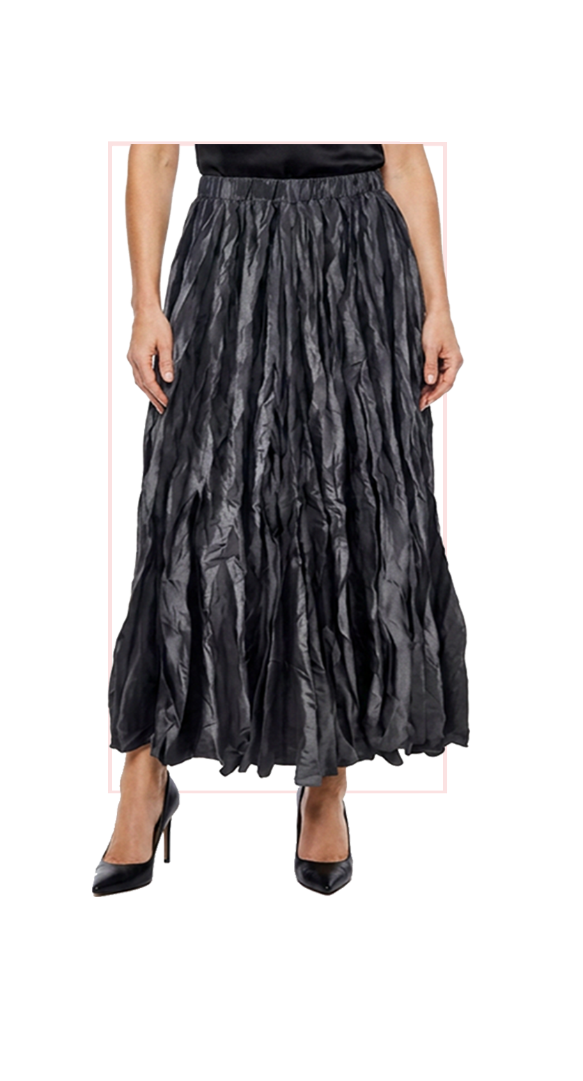 Woman wearing TERRA black pleated midi skirt, front view