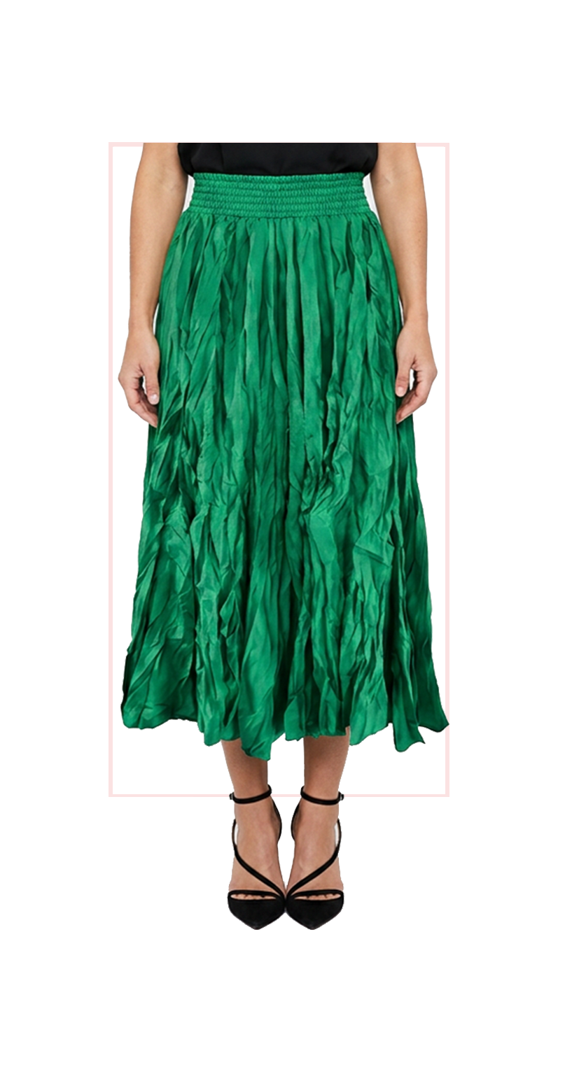 Woman wearing TERRA green pleated midi skirt, front view