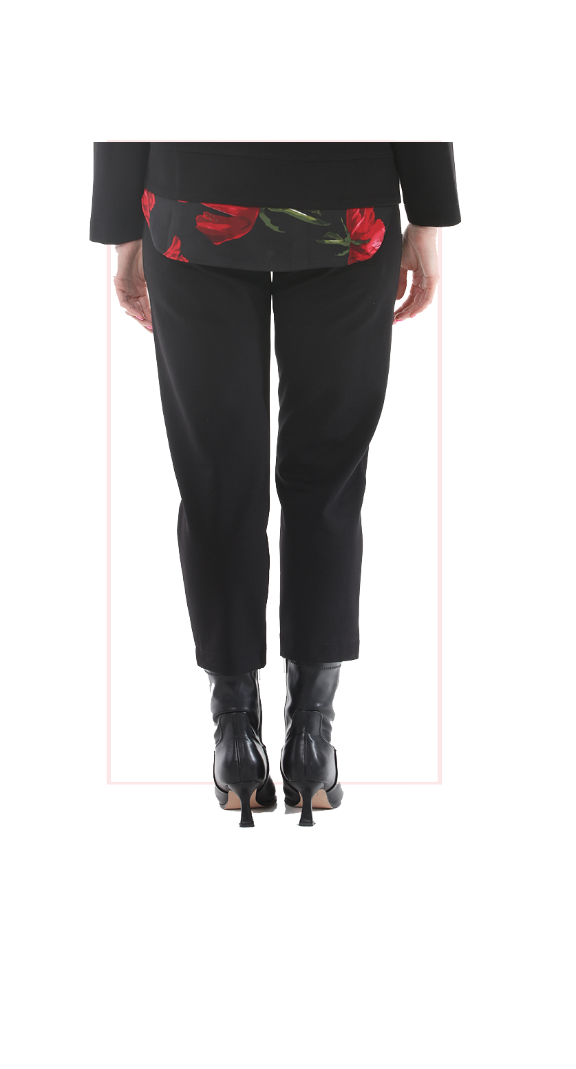 Woman wearing TERRA black high-rise wide-leg trousers with a flowing silhouette rear view