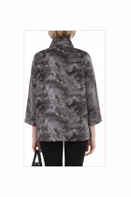 Person wearing a gray patterned jacket on a white background