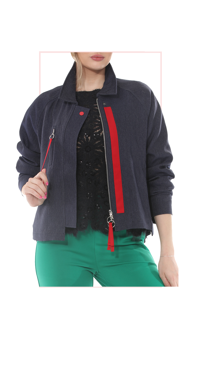 woman wearing a dark jacket with red zipper details on a white background