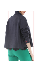 woman wearing a blue coat  and green pants on a white background