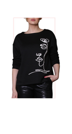 Black sweater with white floral design worn by a person on a white background