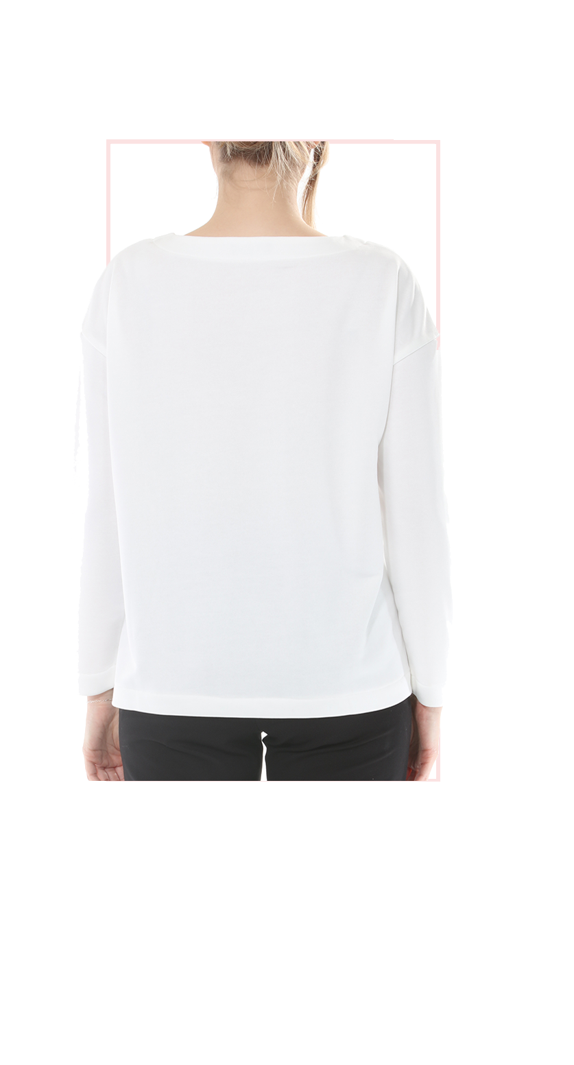 White long-sleeve shirt worn by a person on a white background