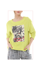 Person wearing a golden kiwi colored sweatshirt with a graphic design on a white background