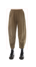 brown pants with black boots on a white background