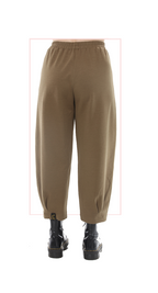 brown pants worn with black boots on a white background