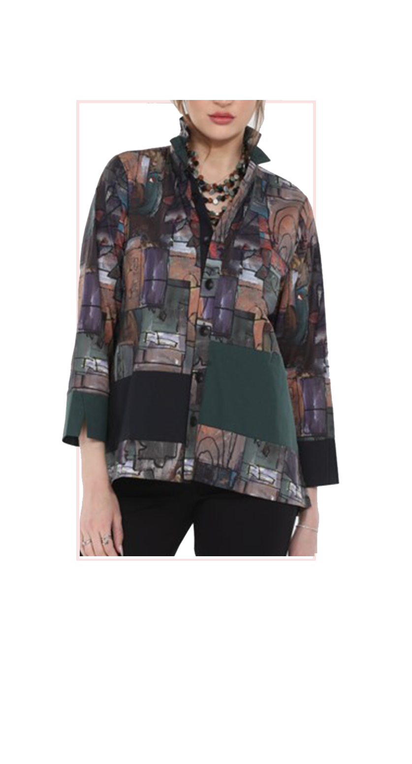 Multicolored patterned shirt worn by a person on a white background